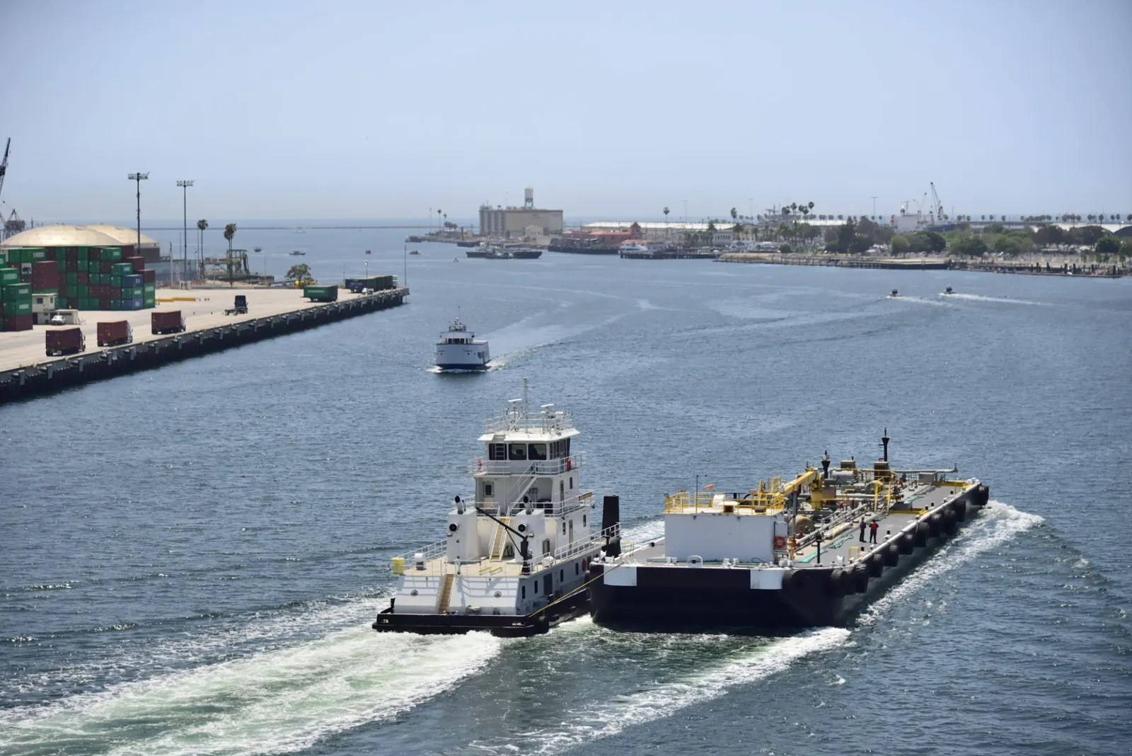 Towboat pushing a barge into port