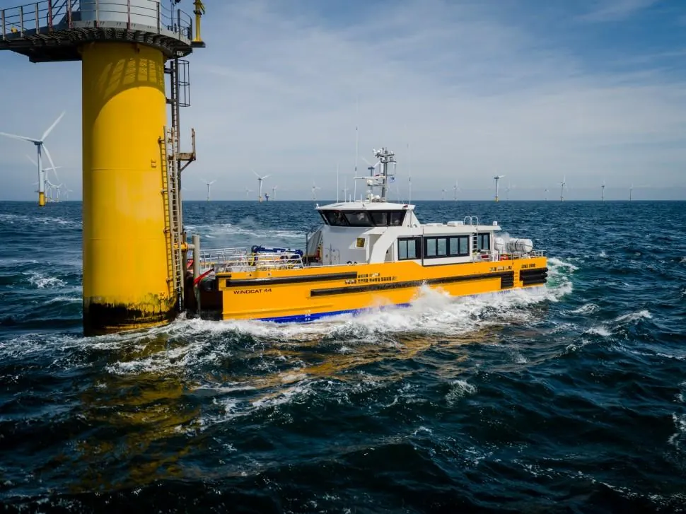 Crew transfer vessel approaching a turbine foundation