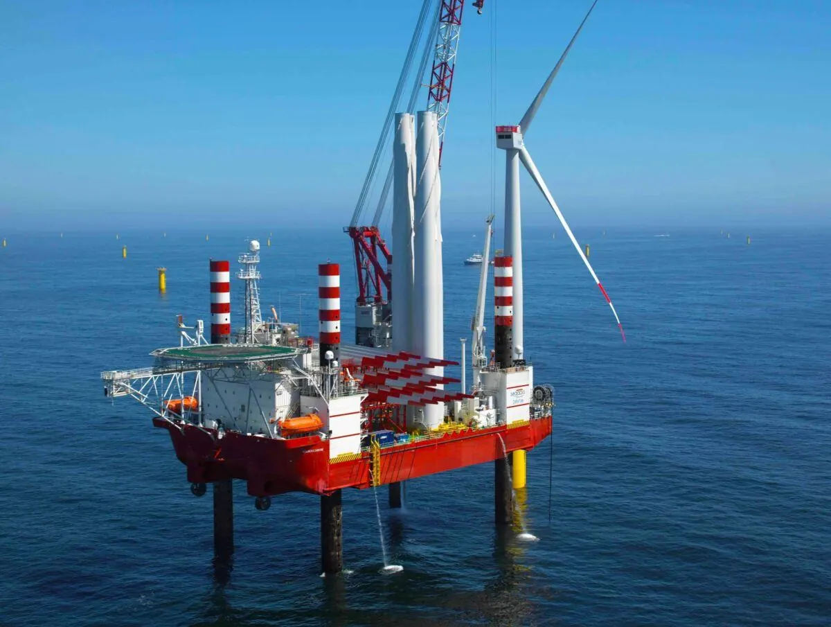 Jack-up installation vessel beside offshore wind turbines