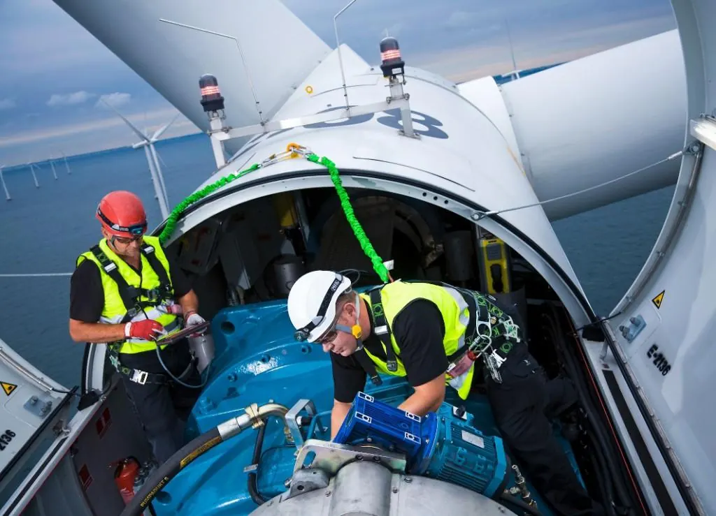 Technicians working inside a turbine nacelle